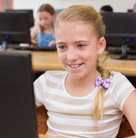 young girl at school desk